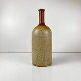 Duo of speckled stoneware and burgundy bottles, 20th century