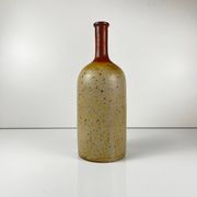 Duo of speckled stoneware and burgundy bottles, 20th century