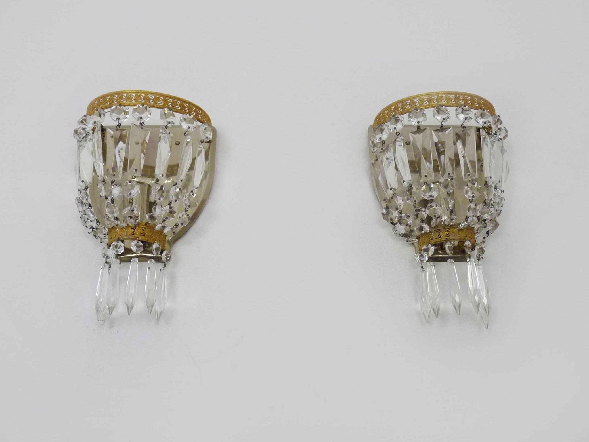 Pair of vintage bronze basket wall lights with glass pendants. The 50's