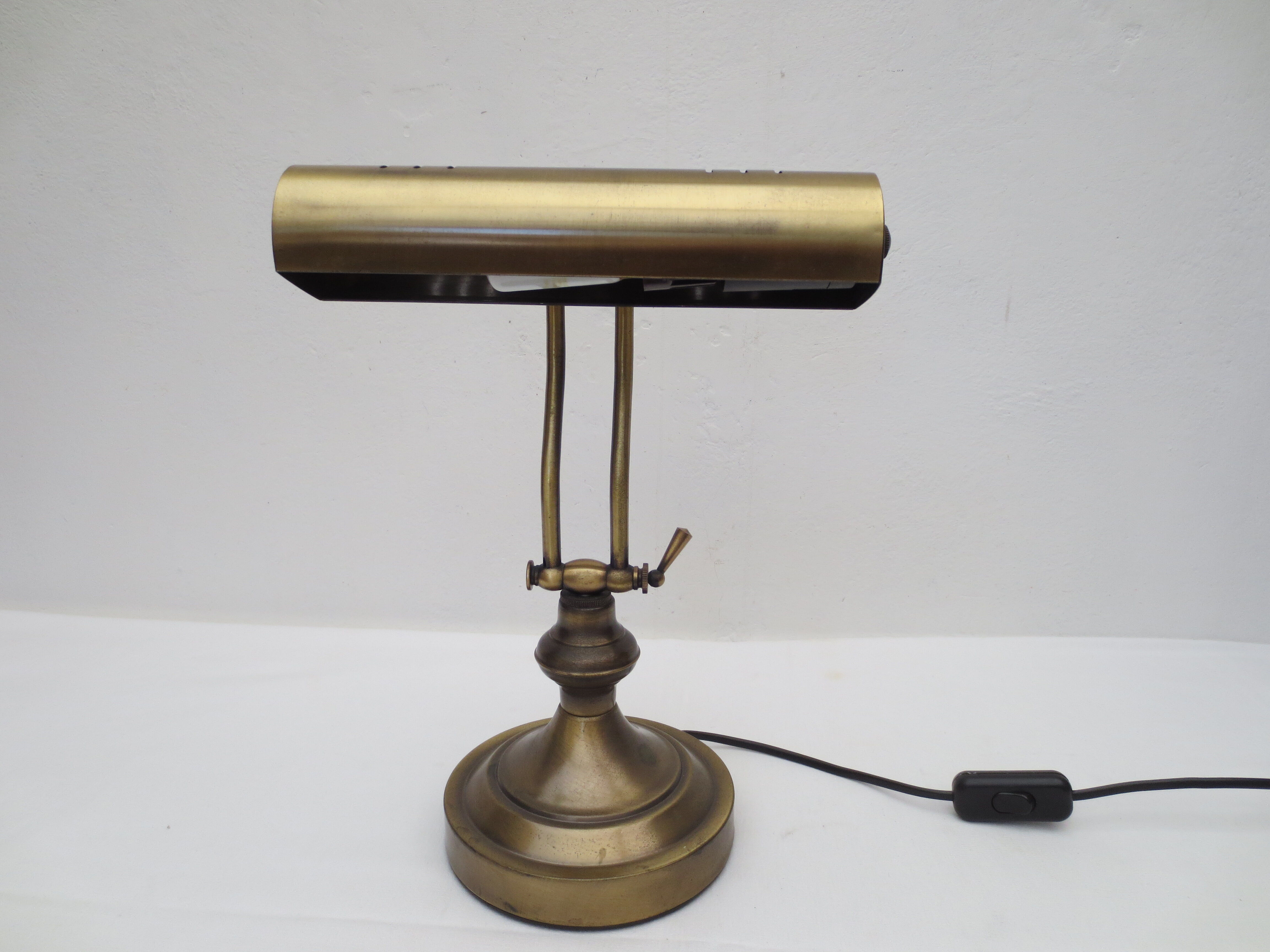 Old aged brass articulated desk lamp