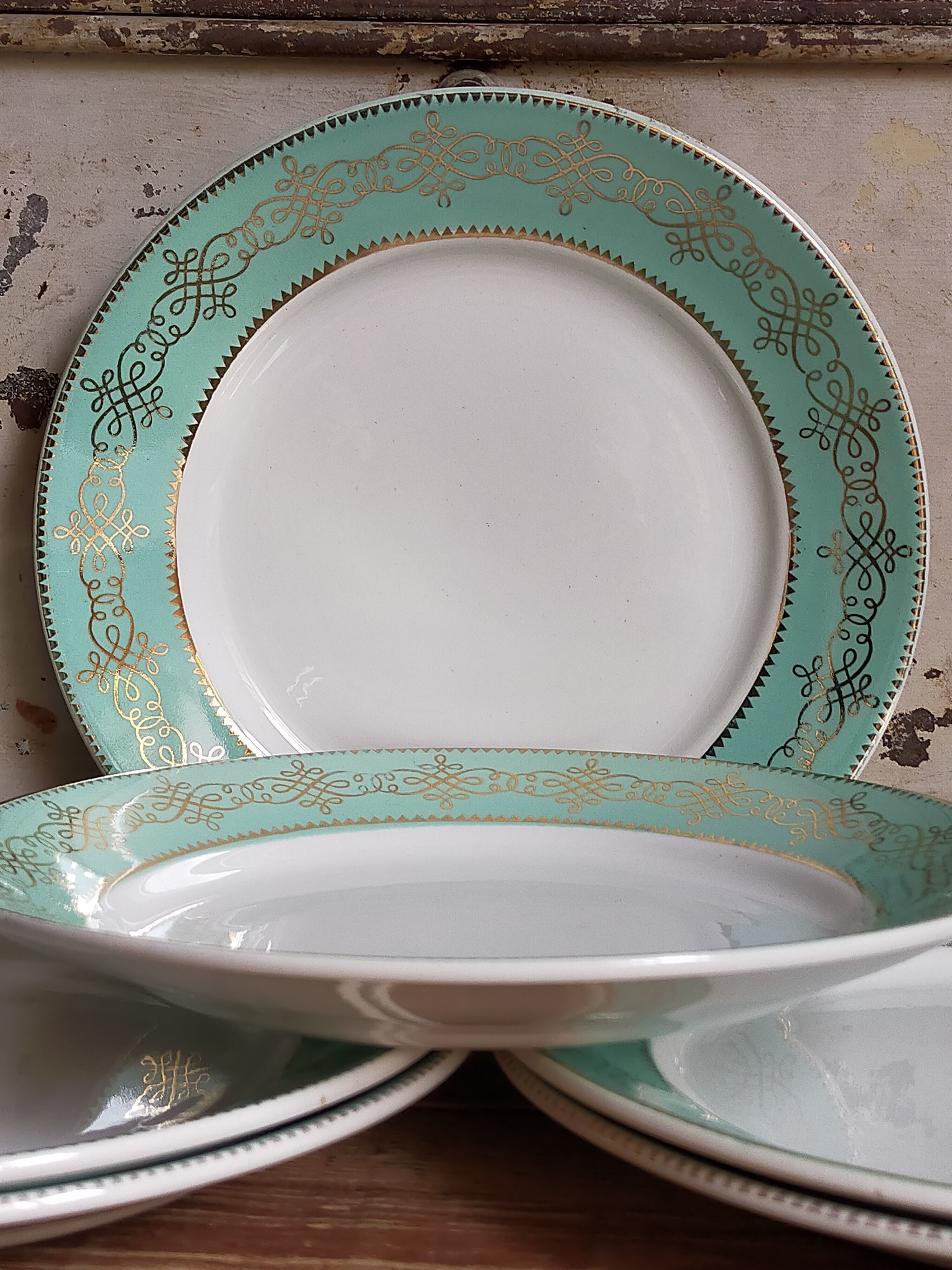 Six plates of vintage Badonviller earthenware with gold frieze