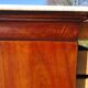 Antique mahogany chest of drawers with white marble.