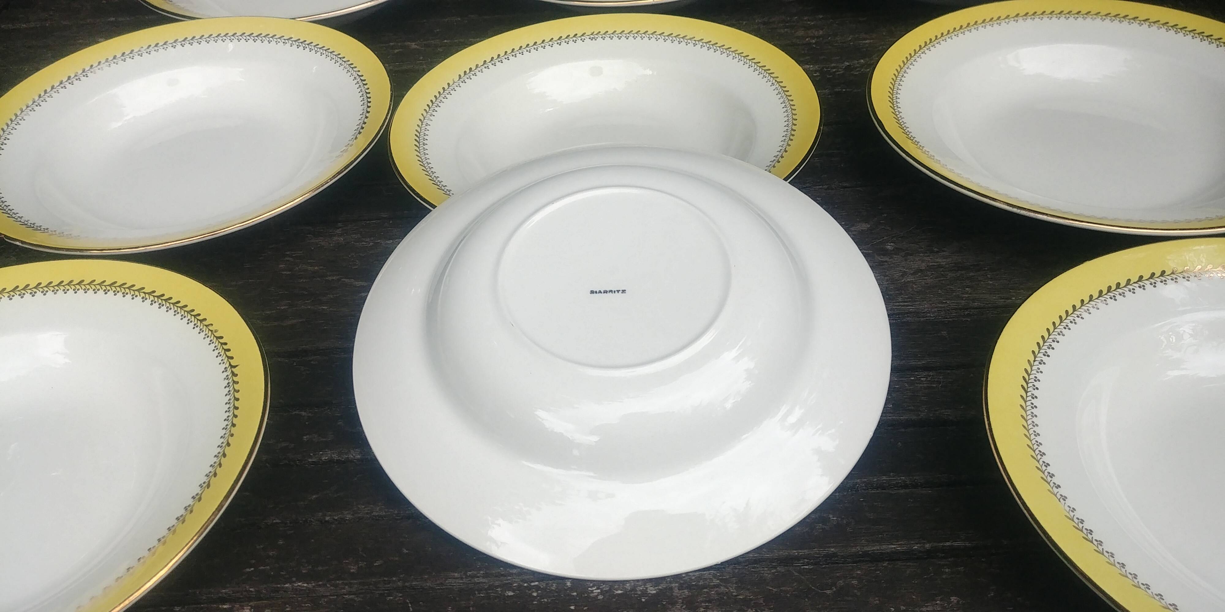 Set of thirteen old porcelain soup plates signed "Biarritz"