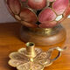 Handheld candlestick in bronze, card game decoration