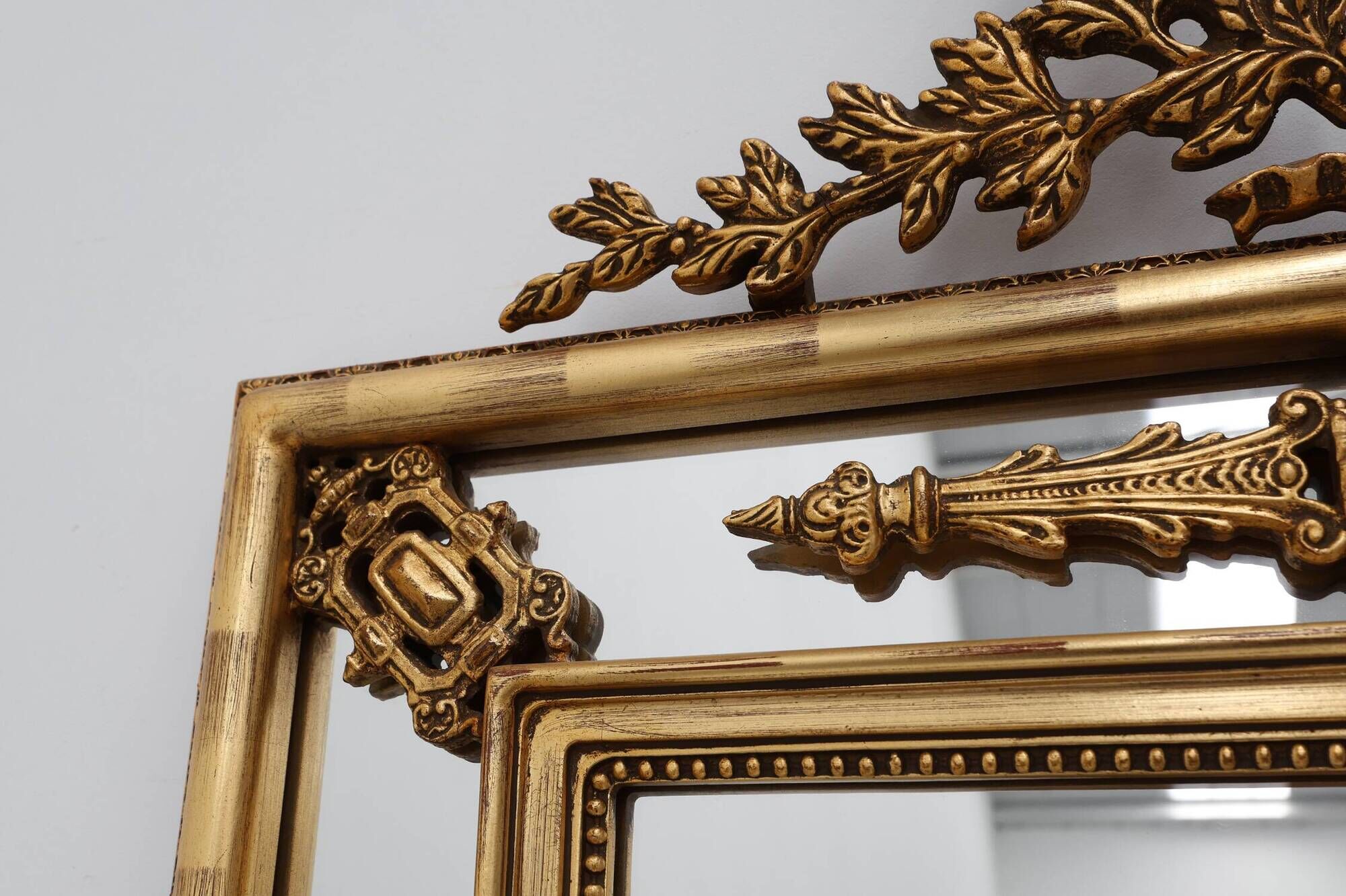 Louis XVI style gilt mirror with laurel wreath crest, Belgium, 20th century