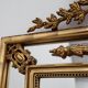 Louis XVI style gilt mirror with laurel wreath crest, Belgium, 20th century