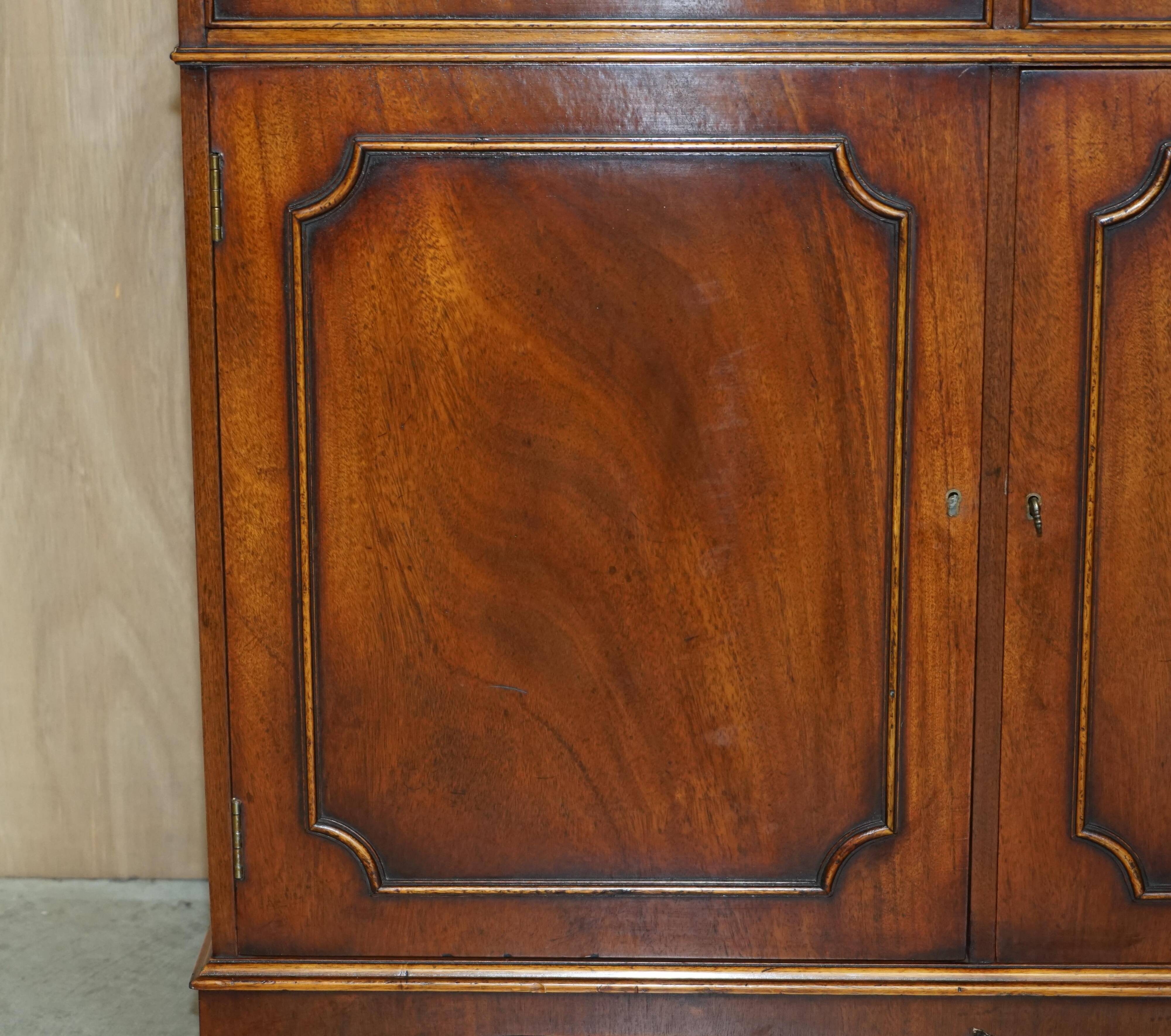 Vintage mahogany buffet with three drawers and shelves.