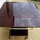 Chic serving table on wheels from the 60s with brass decorations and two shelves.