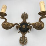 Antique bronze wall light with arm decorated with swans and palmettes in the Empire style