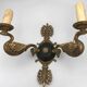 Antique bronze wall light with arm decorated with swans and palmettes in the Empire style