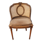 Antique Louis XVI chair in wood and cane from the 19th century.