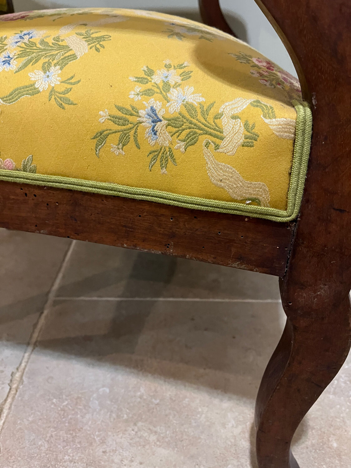 Louis XV style cabriolet armchair in solid wood, yellow floral fabric.
