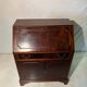 Antique mahogany secretary, upholstered flap and interior storage