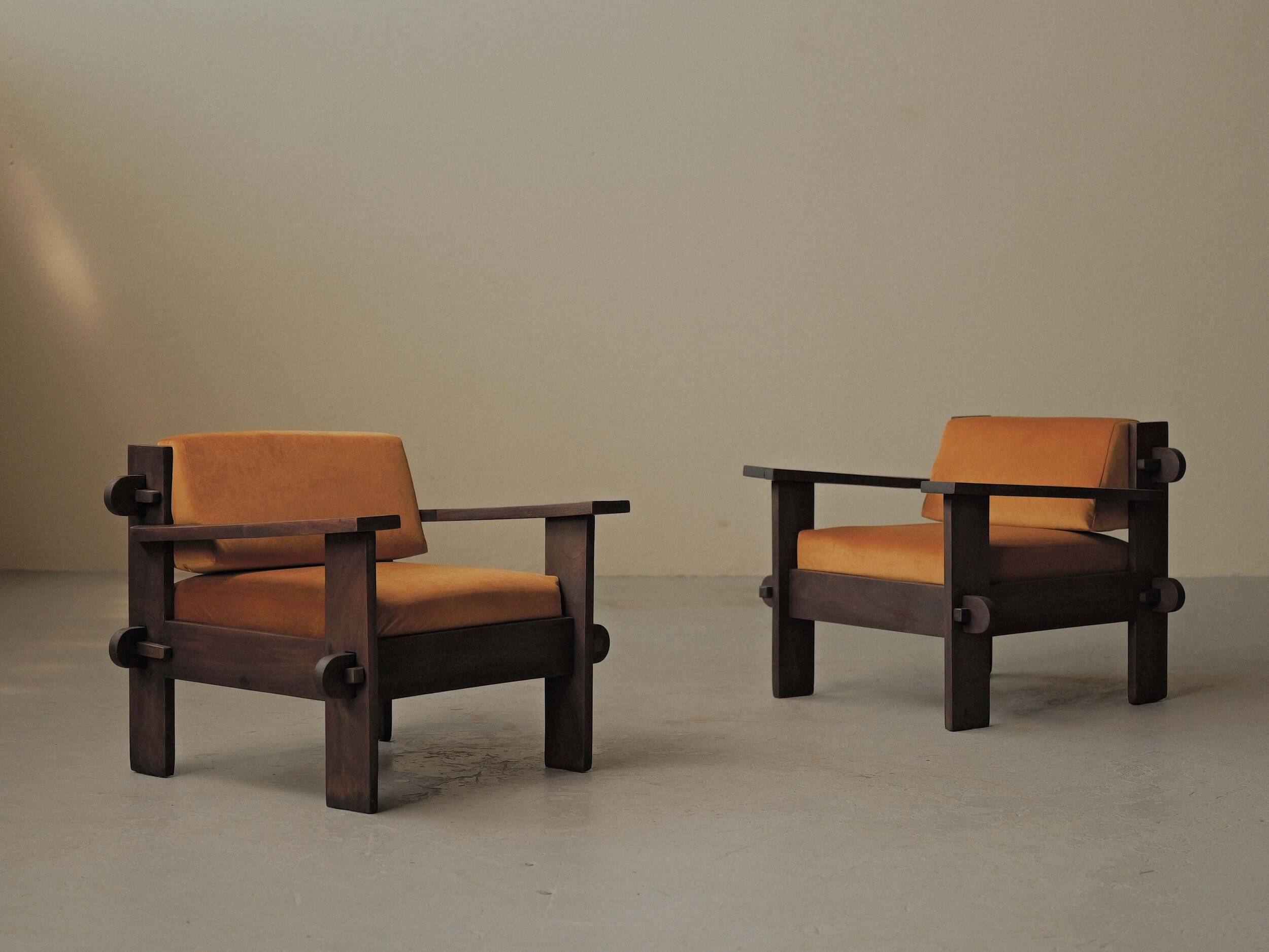 Pair of architect's armchairs in solid wood, France, circa 1970.