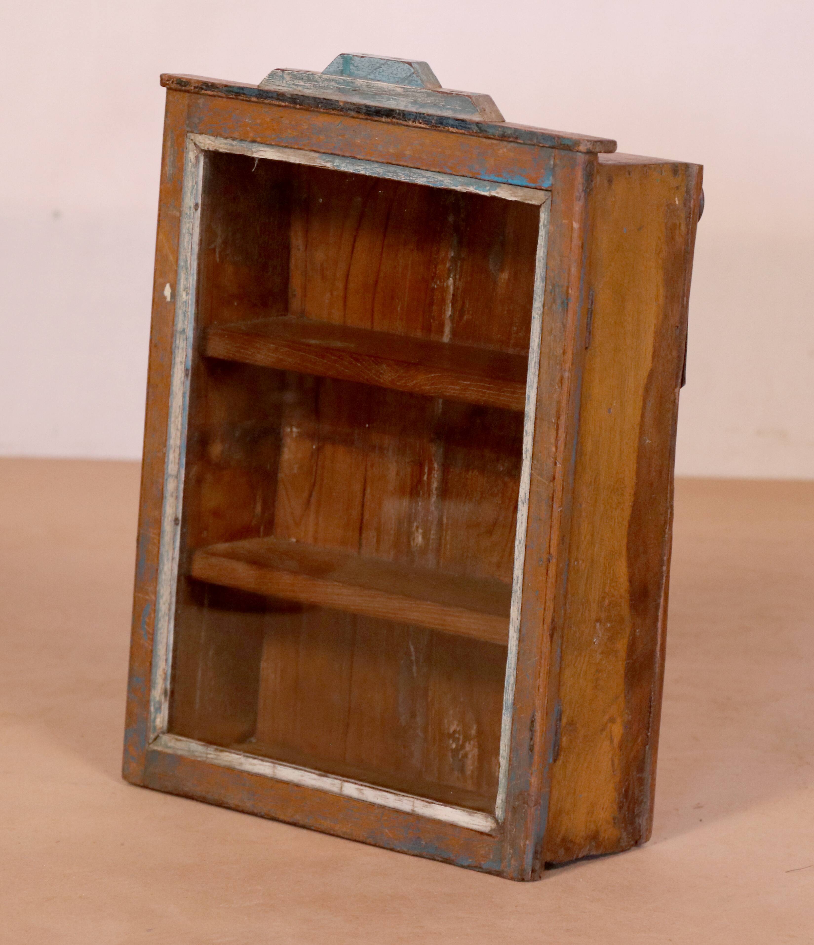 Old art deco wall display case in burmese teak