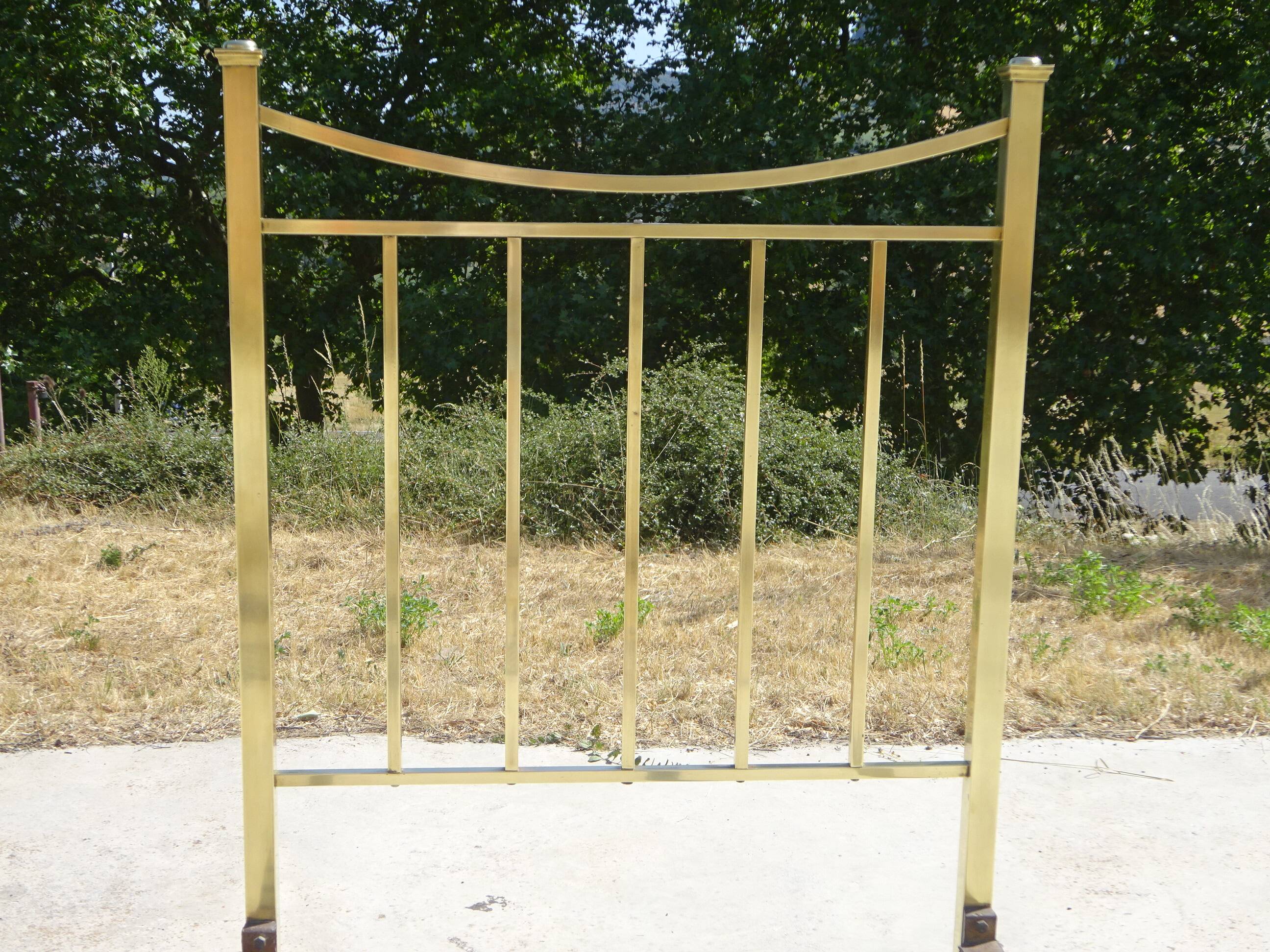 Antique gold-plated brass bed for one person.