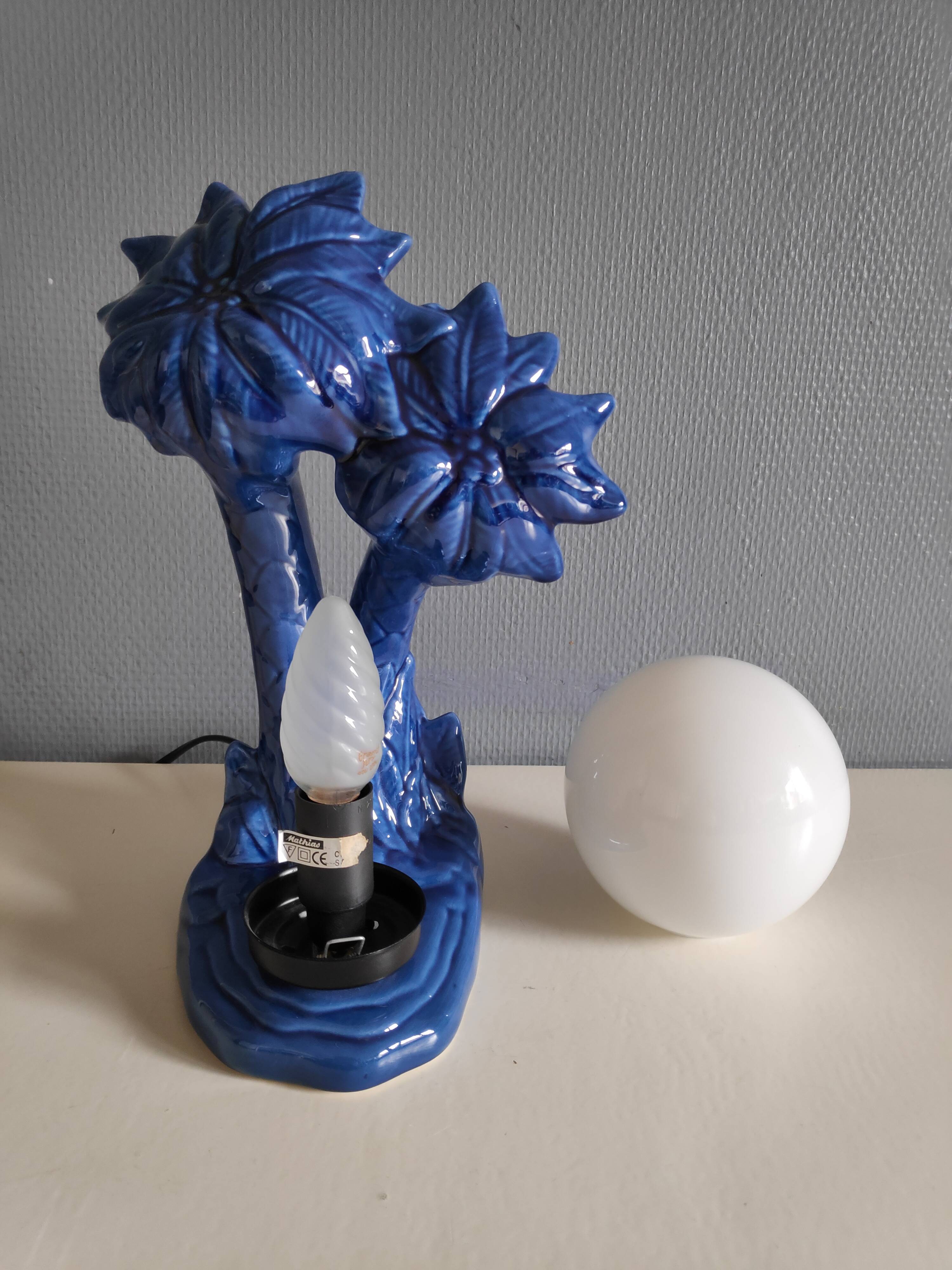 Blue ceramic palm lamp and white opaline globe