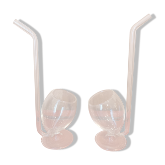 Pair of glasses with integrated straw
