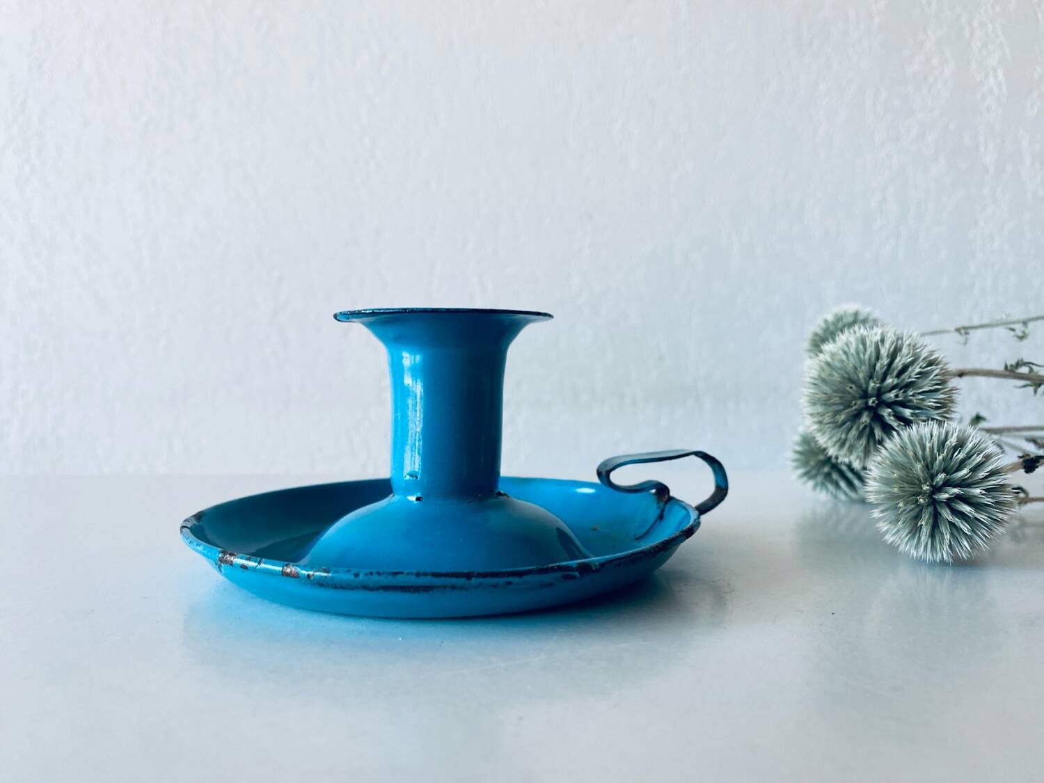 Antique enamelled metal candle holder