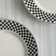 Pair of vintage plates with a black and white checkered pattern.