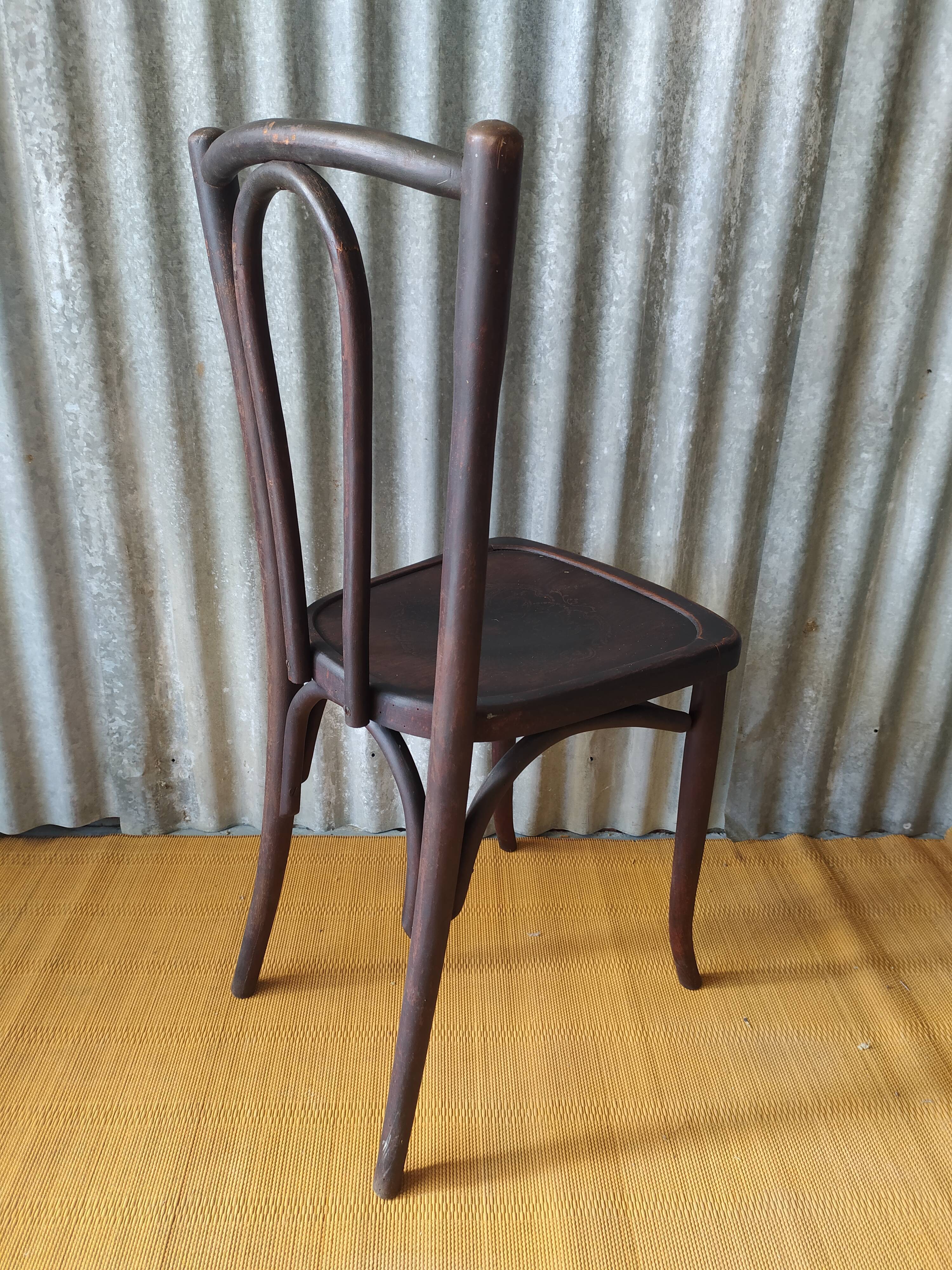 Curved wooden bistro chair