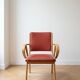 Vintage 1950s armchair in wood and red faux leather.