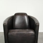 Cow leather Aviator design armchair in a dark colour scheme