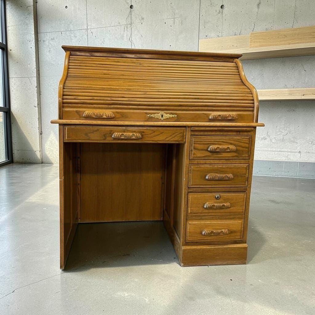 Vintage American wooden desk with a roll-top.