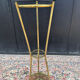 Golden tripod stand with smoked glass from the 1970s.