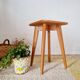 Wooden stool with tapered legs