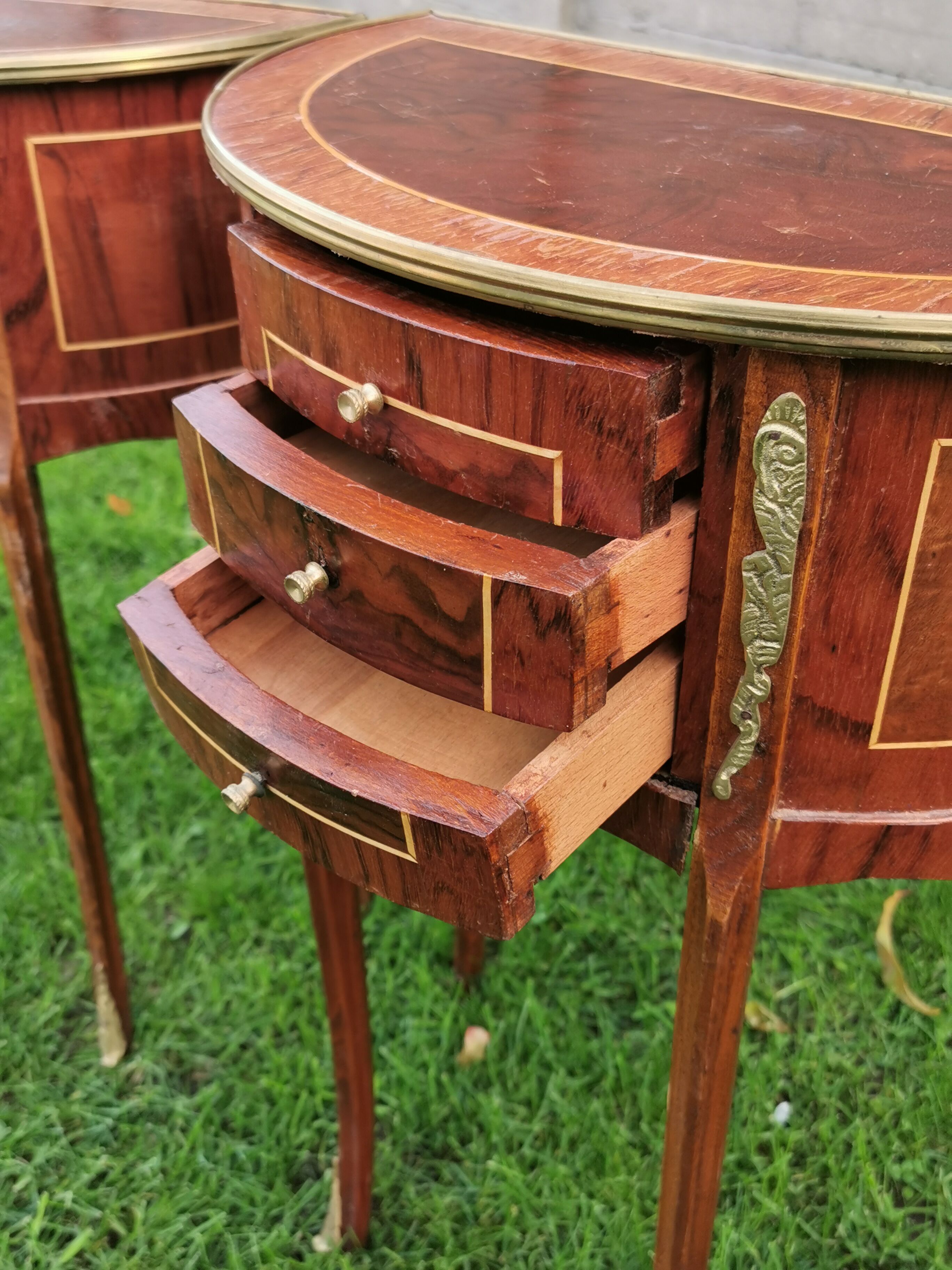 half-moon bedside pair in marquetry, bronze ornaments