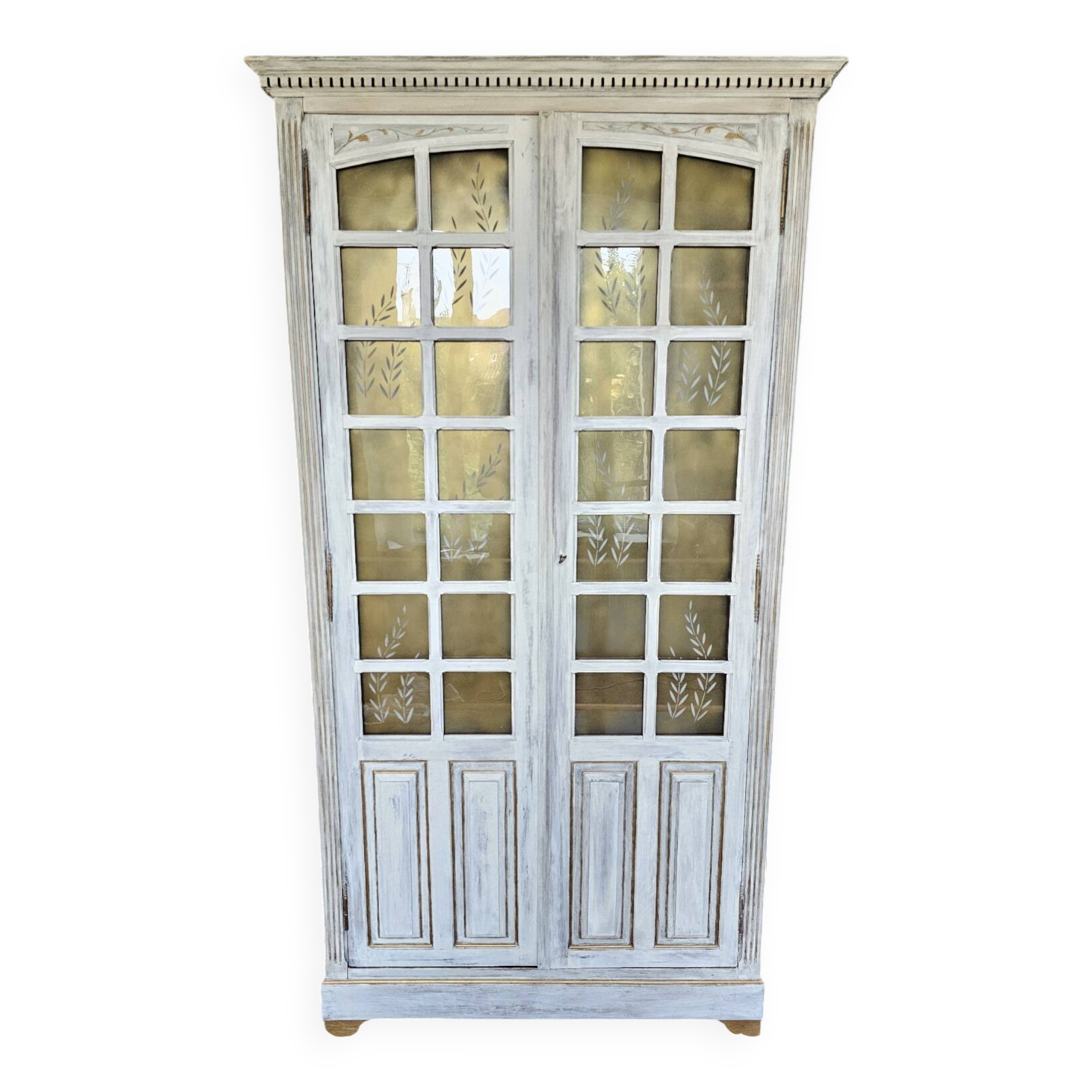 Antique bookcase with a white cerused patina