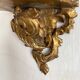 Antique wall console in wood and gilded stucco.