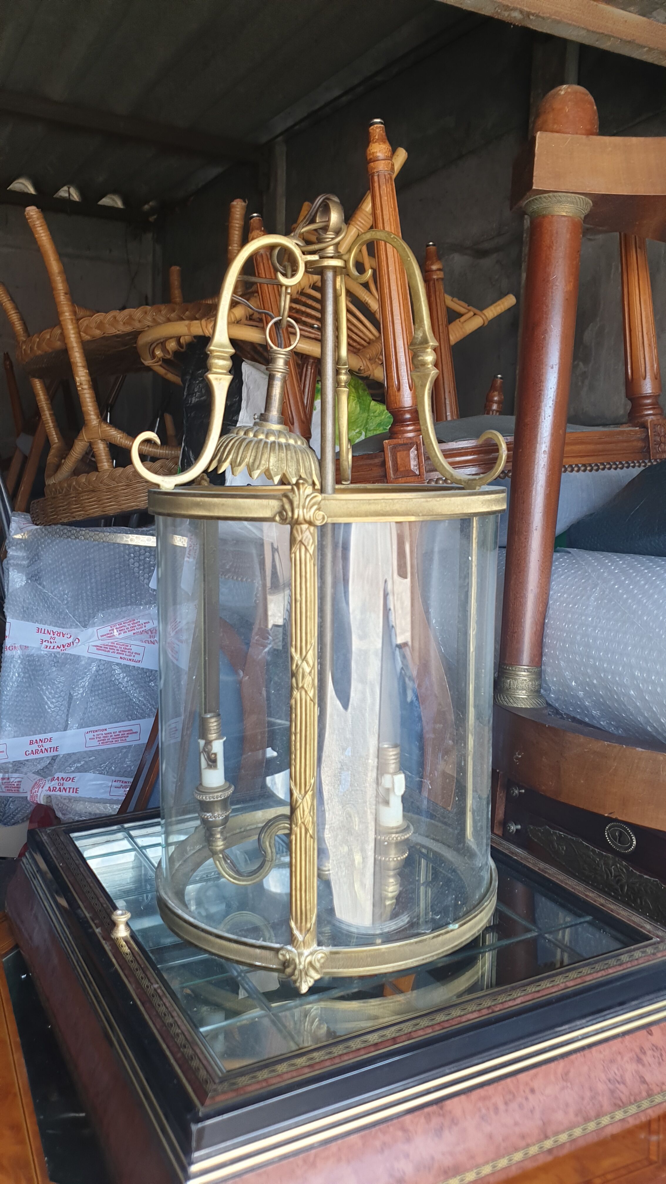 Suspension in glass and brass