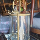 Suspension in glass and brass