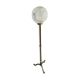 Brass floor lamp with a round glass globe