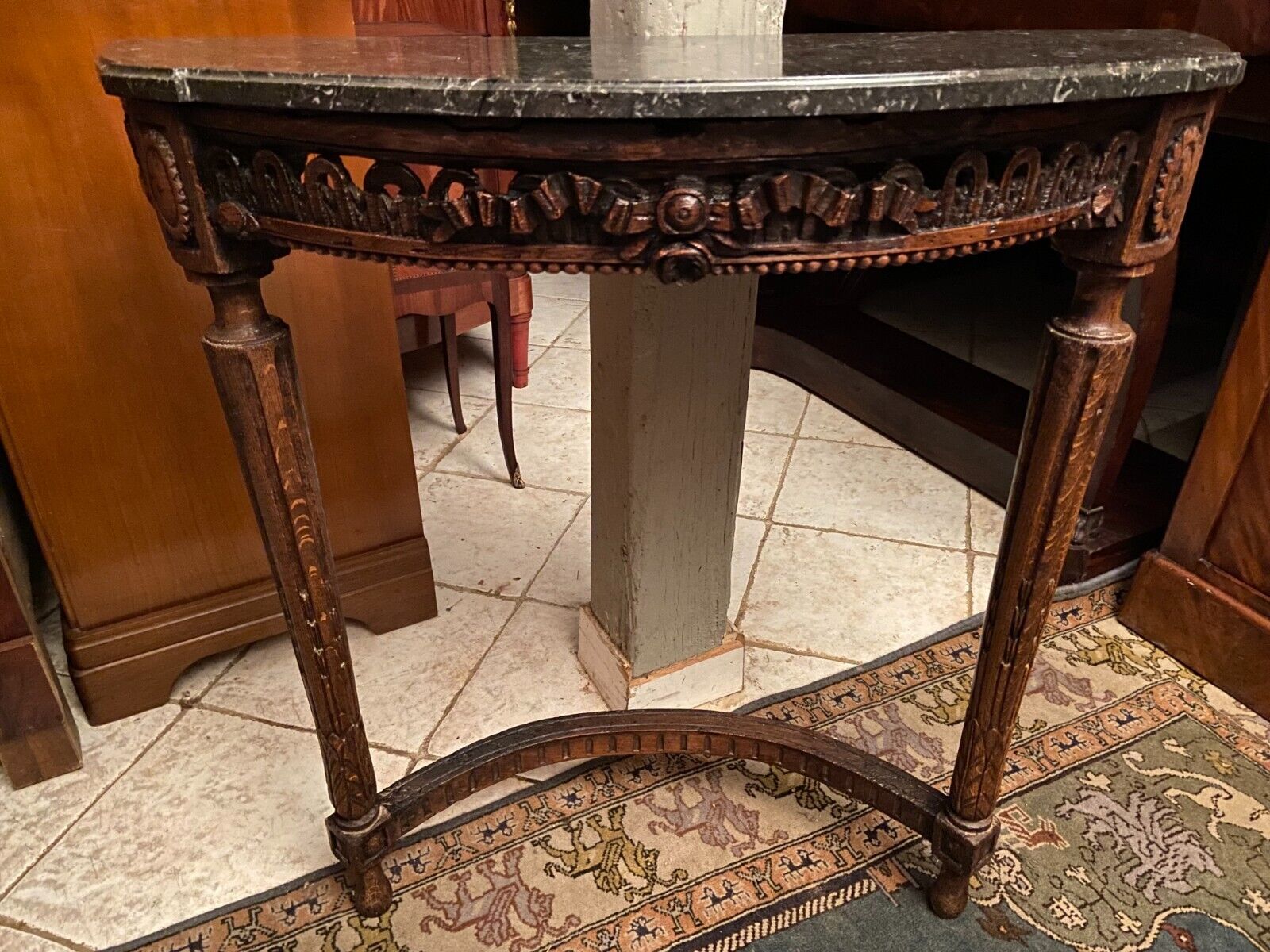 Half-moon console eighteenth century solid oak with carved decoration Louis XVI era