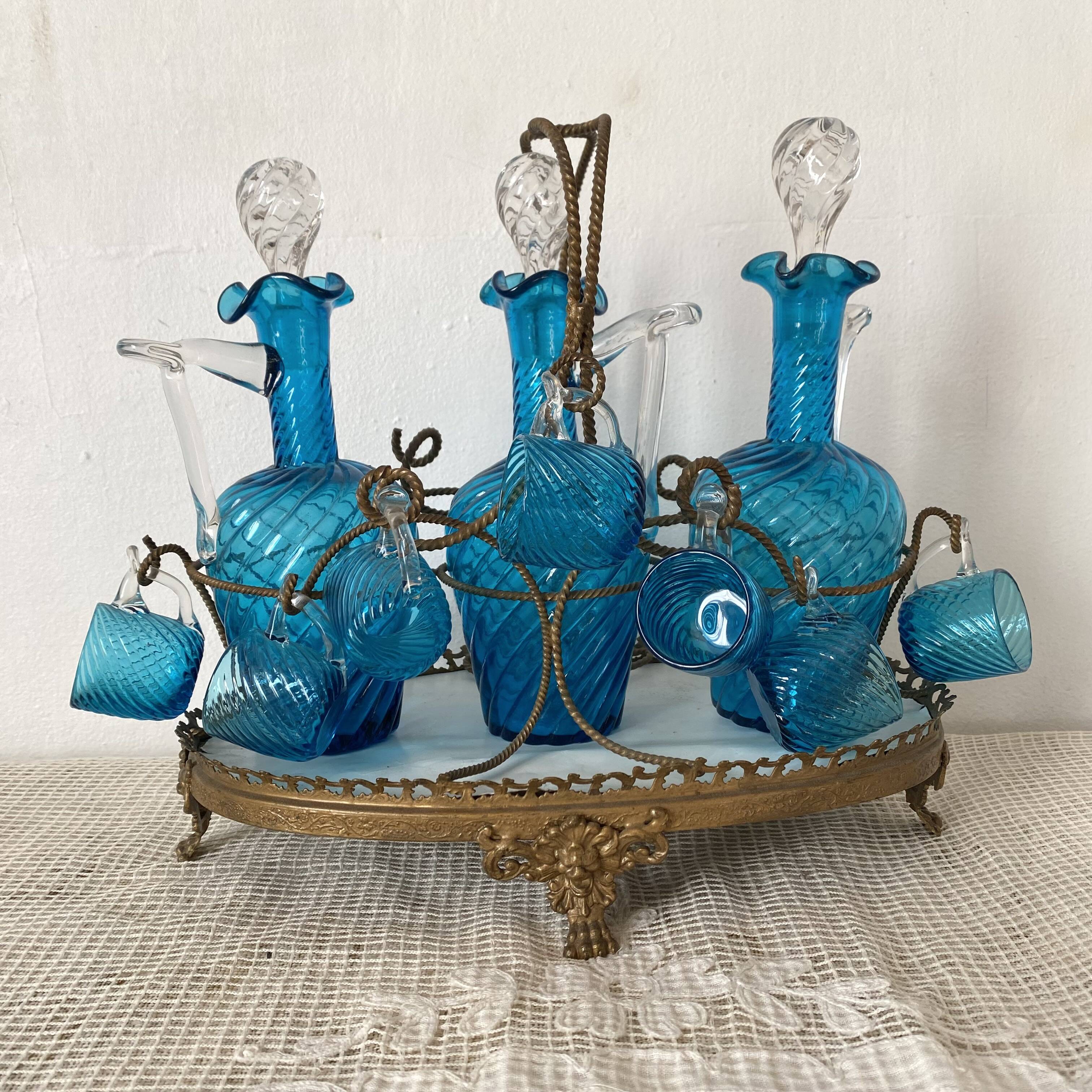 Antique Legras liquor cabinet, decanters and glasses, lion's paw stand