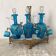 Antique Legras liquor cabinet, decanters and glasses, lion's paw stand