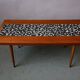 1970s coffee table with a tapered teak base and ceramic mosaic.