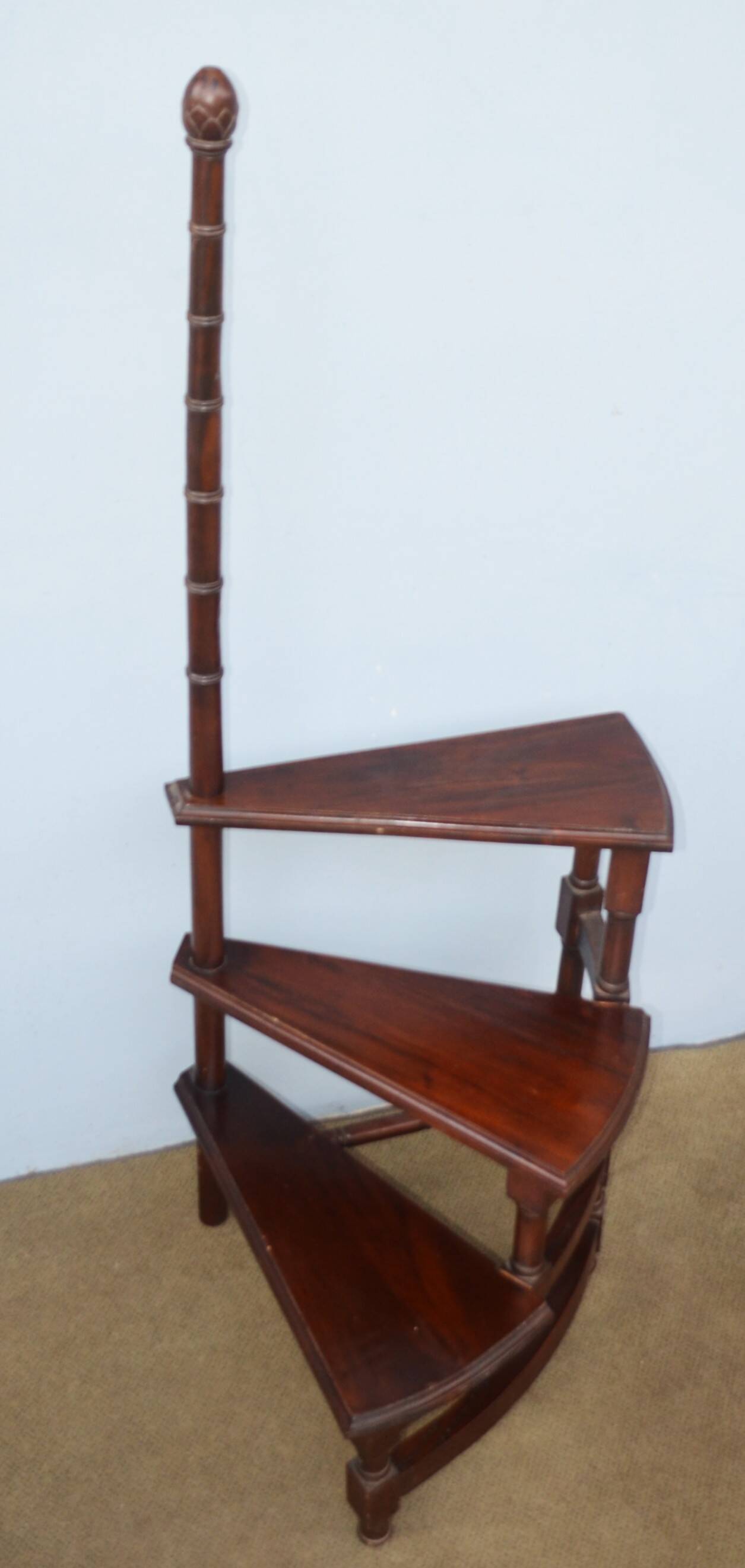 Spiral staircase for library made of mahogany wood