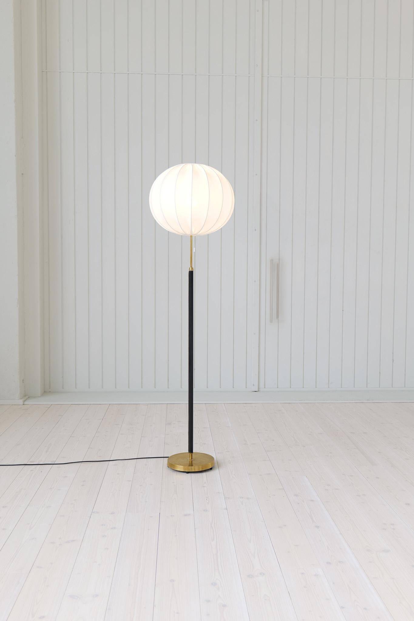Mid-century black leather floor lamp by Falkenbergs Belysning, Sweden, 1960s.