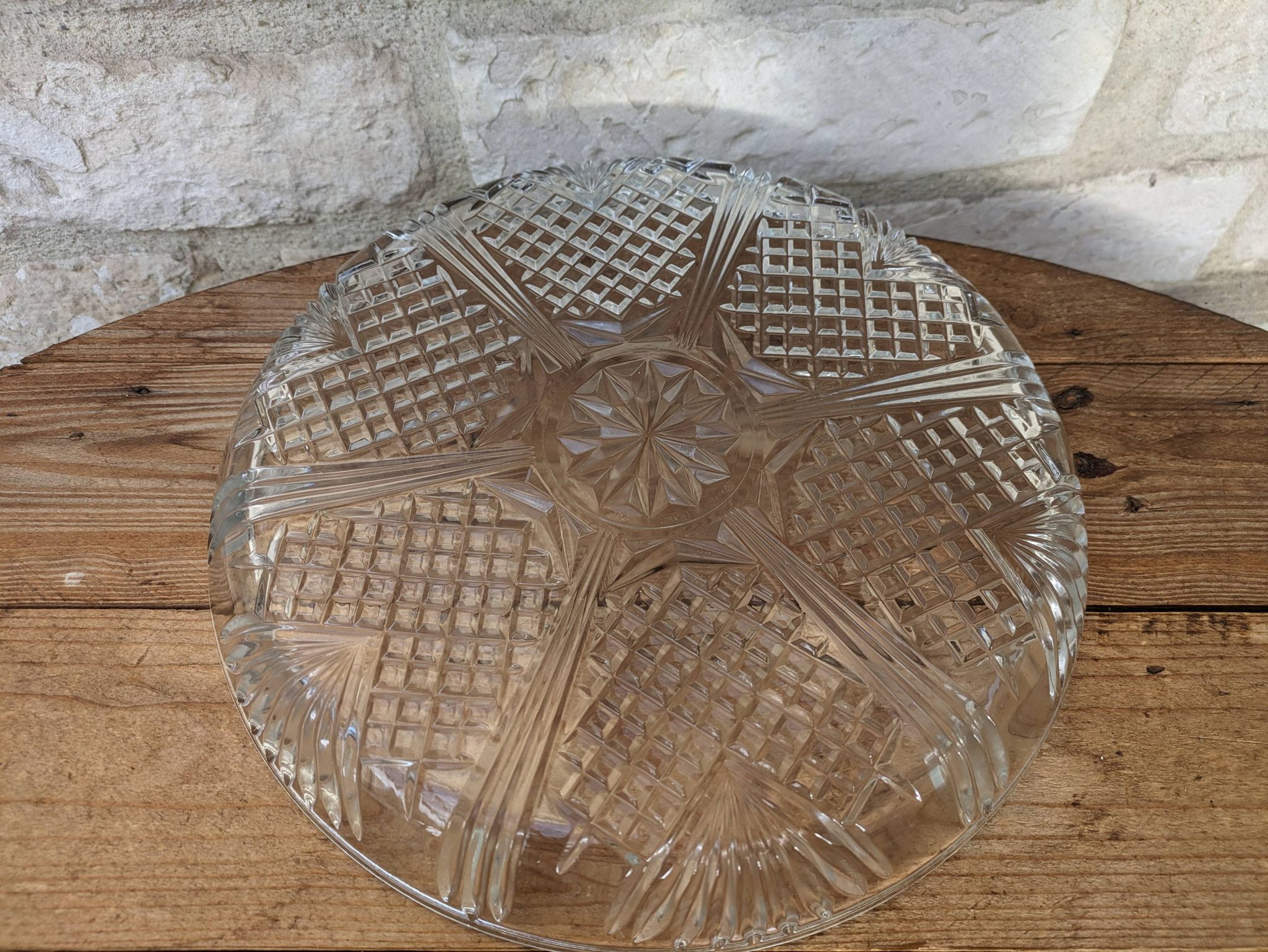 Relief molded glass plate serving dish with rim