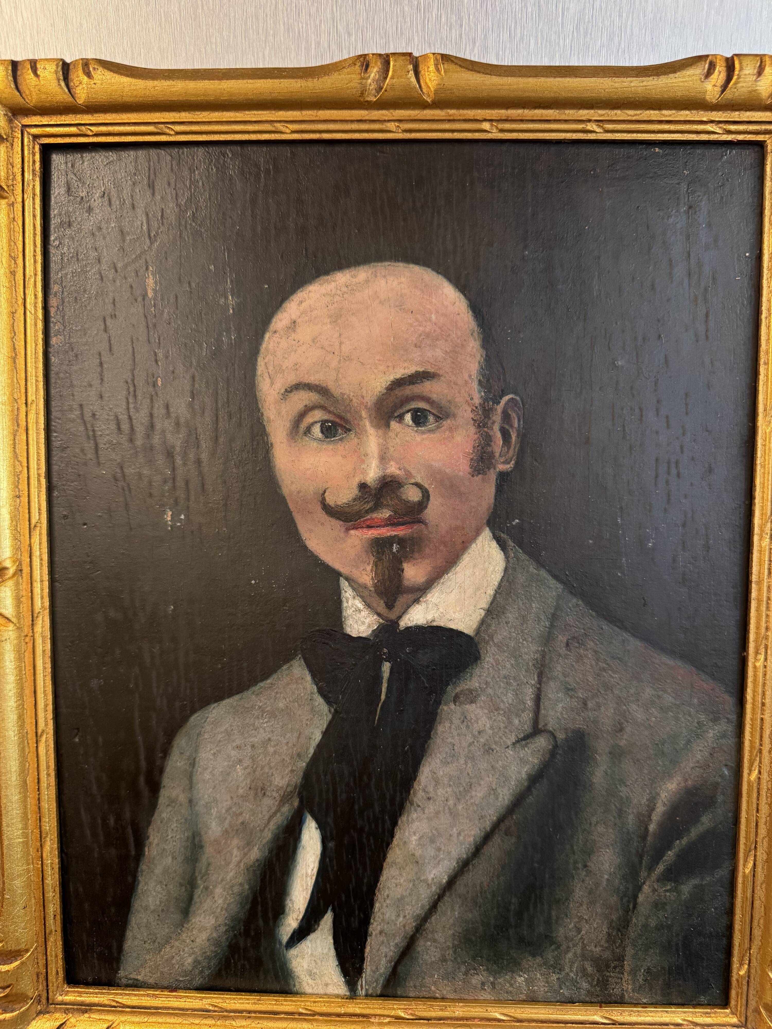 Portrait of a dandy with a moustache from the early 20th century.