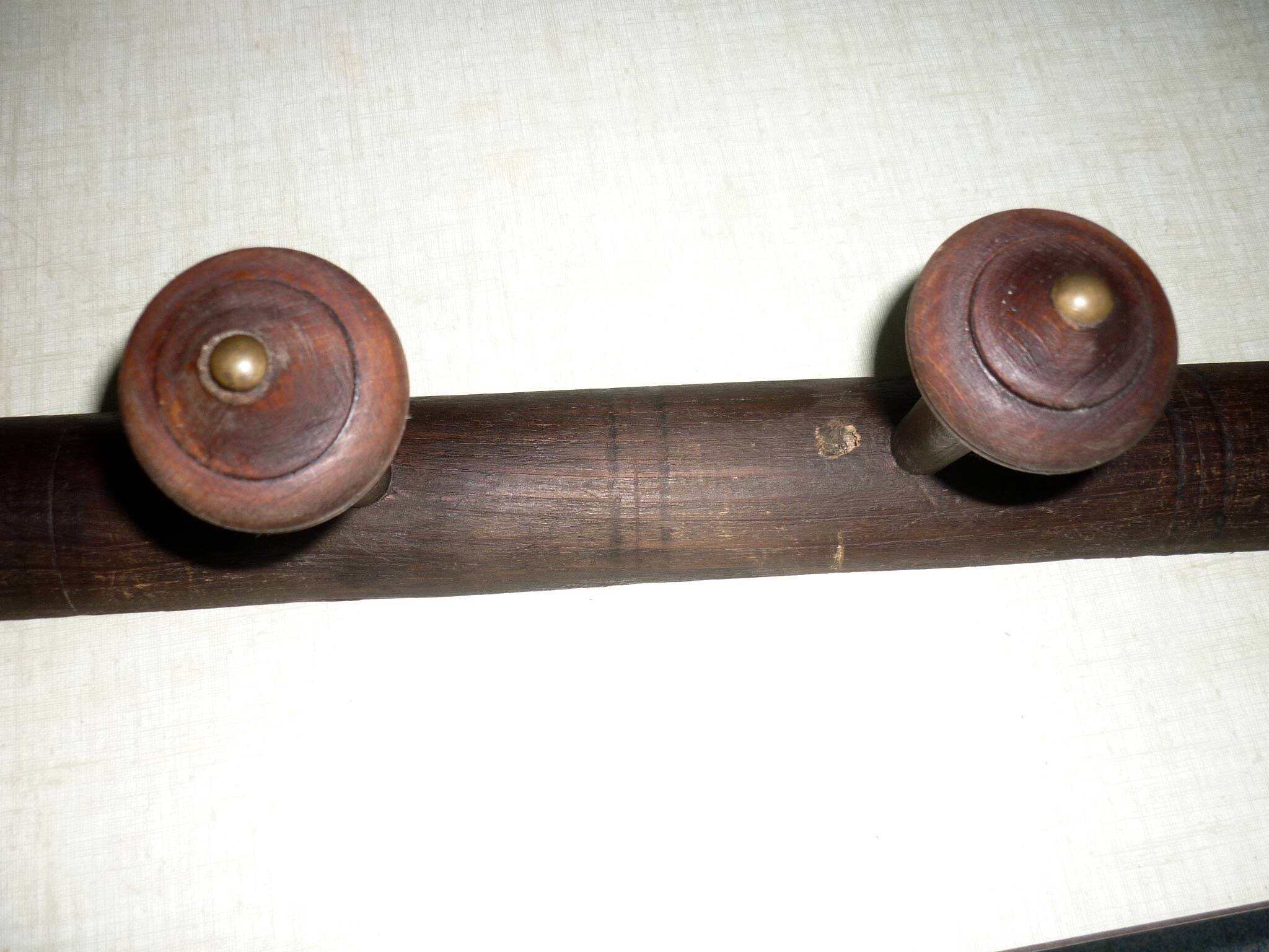 Wooden wall-mounted coat rack