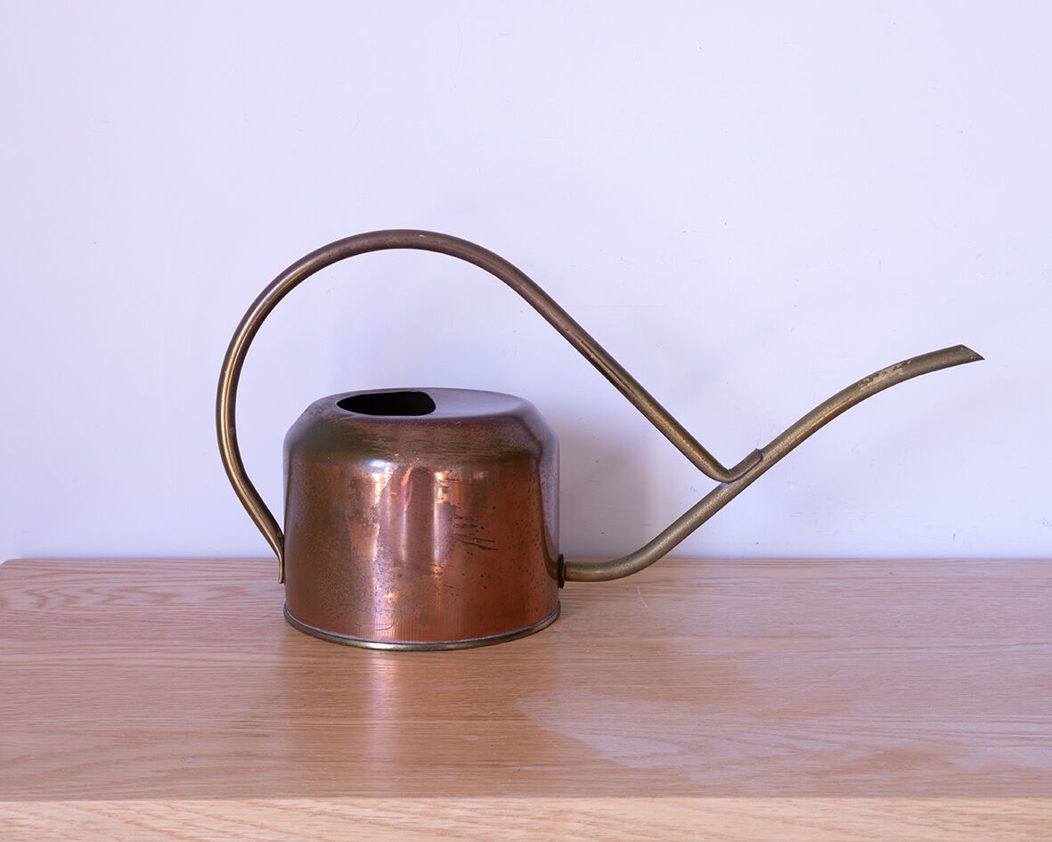 Copper and brass watering can