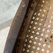 Pair of antique caned and wooden chairs from the 1900s.