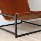 Pair of vintage armchairs in stretched leather and metal structure