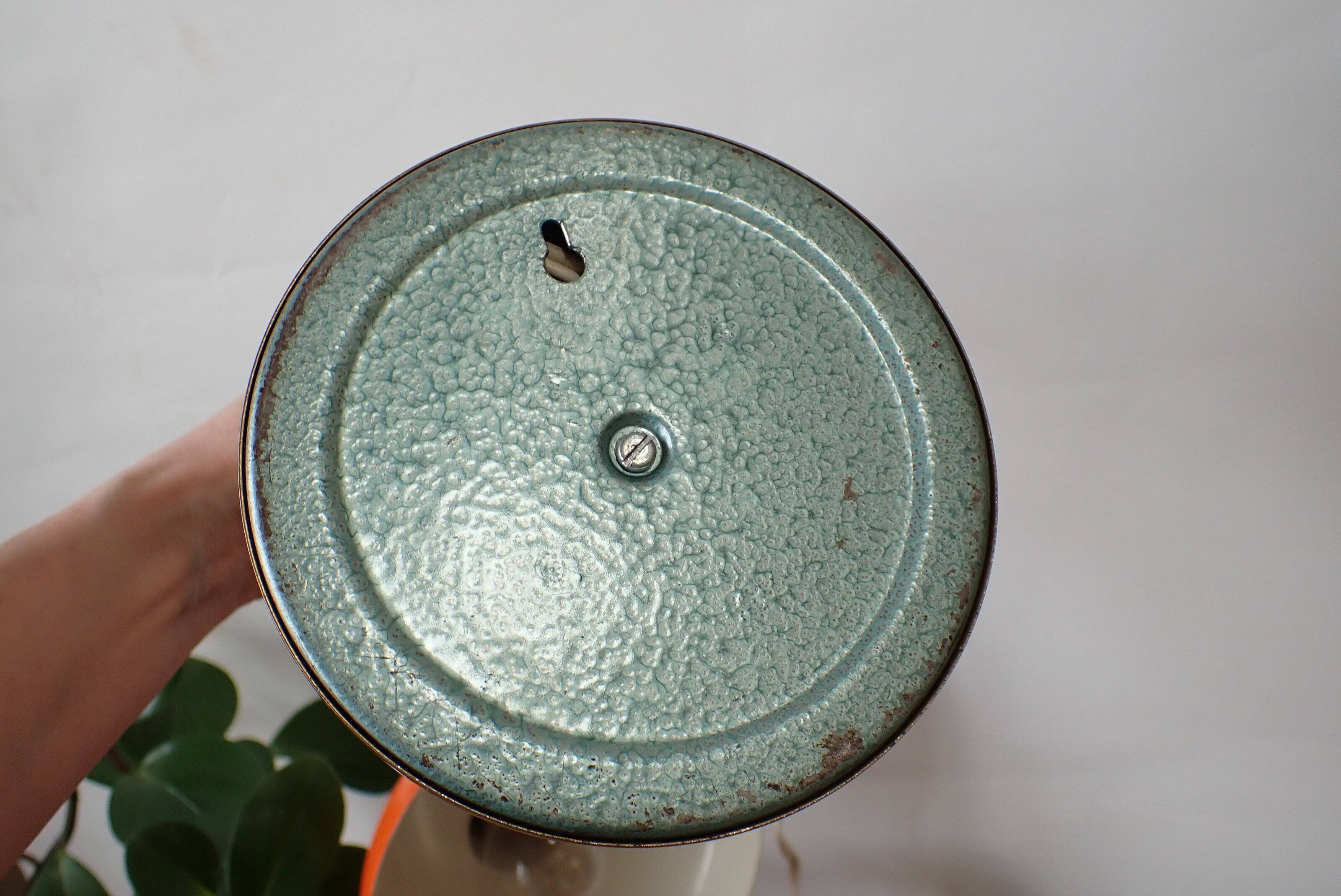 Vintage adjustable lamp, orange, made of metal.