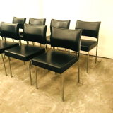 Suite of eight vintage chairs in chrome and imitation leather XX century